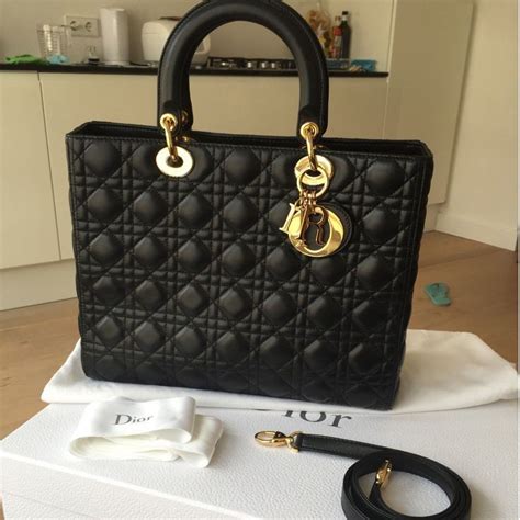 large black lady dior bag.